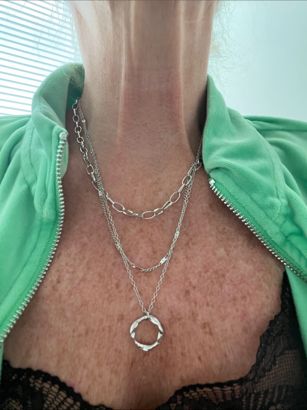 Layered Silver-Tone Multi-Chain Necklace with Twisted Circle Pendant